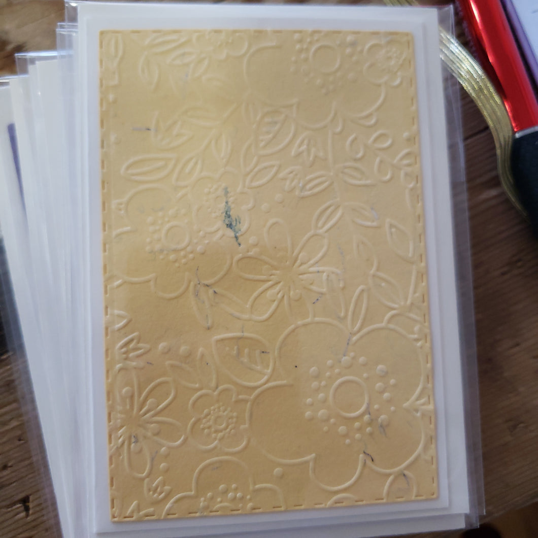 Assorted embossed ivory card