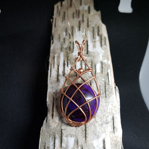 Pos round purple agate cab copper wrap cris-cross pendant