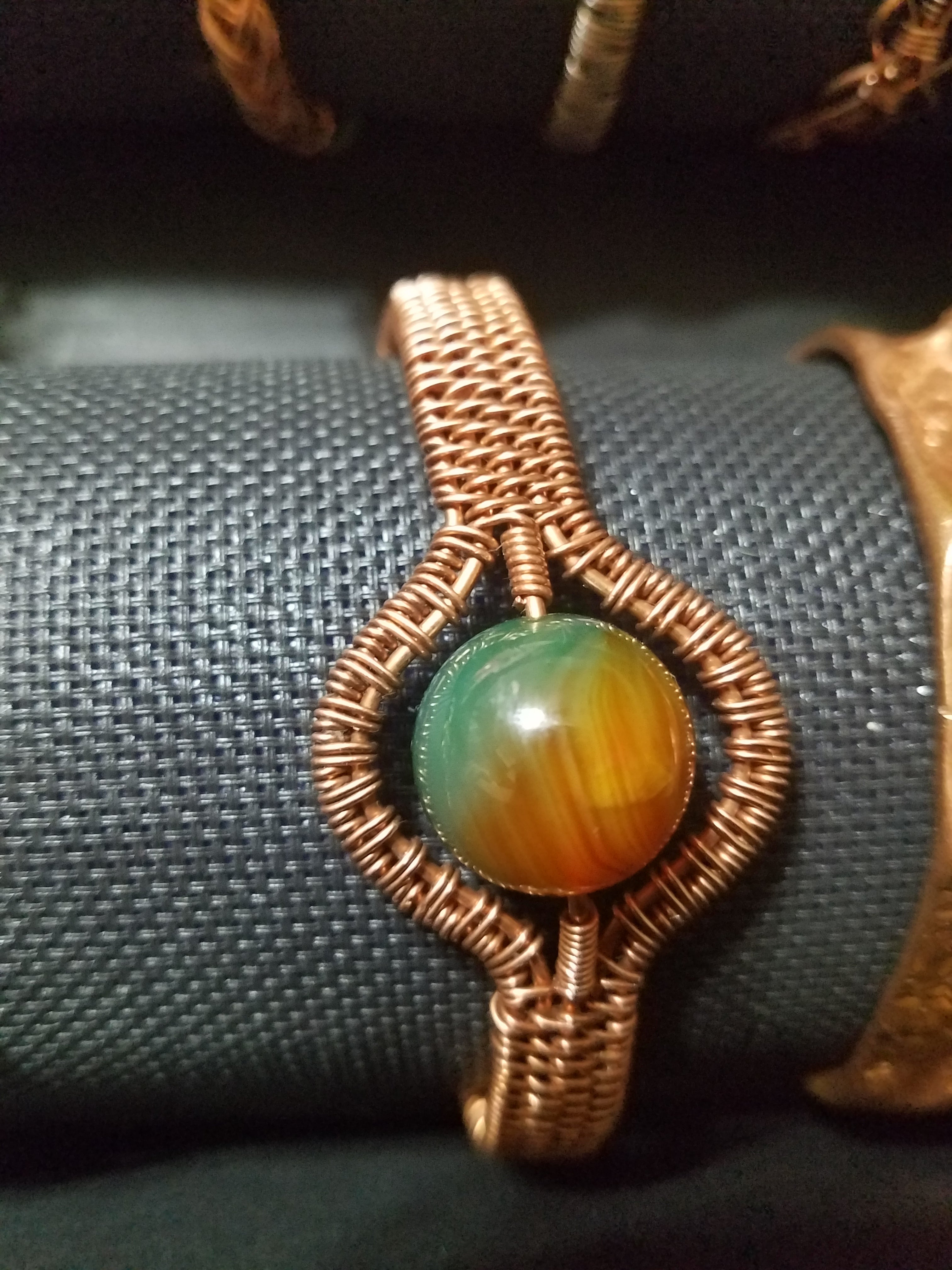 Woven bracelet with bead