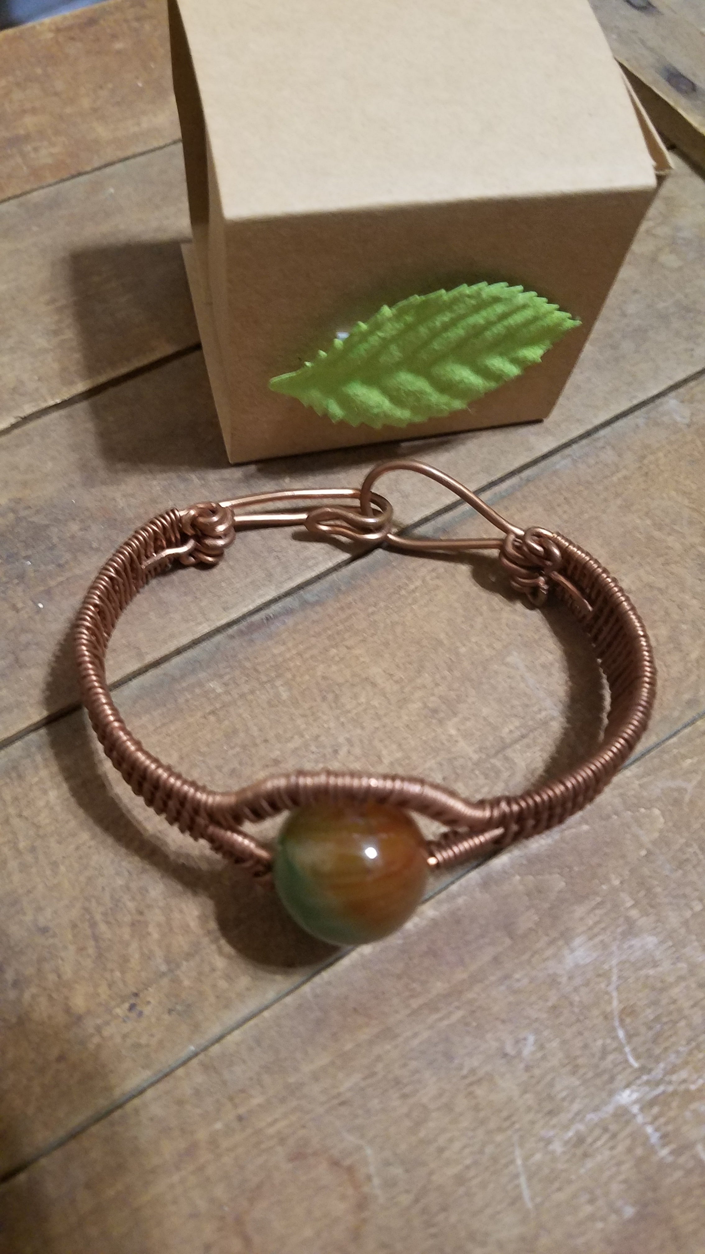 Woven bracelet with bead